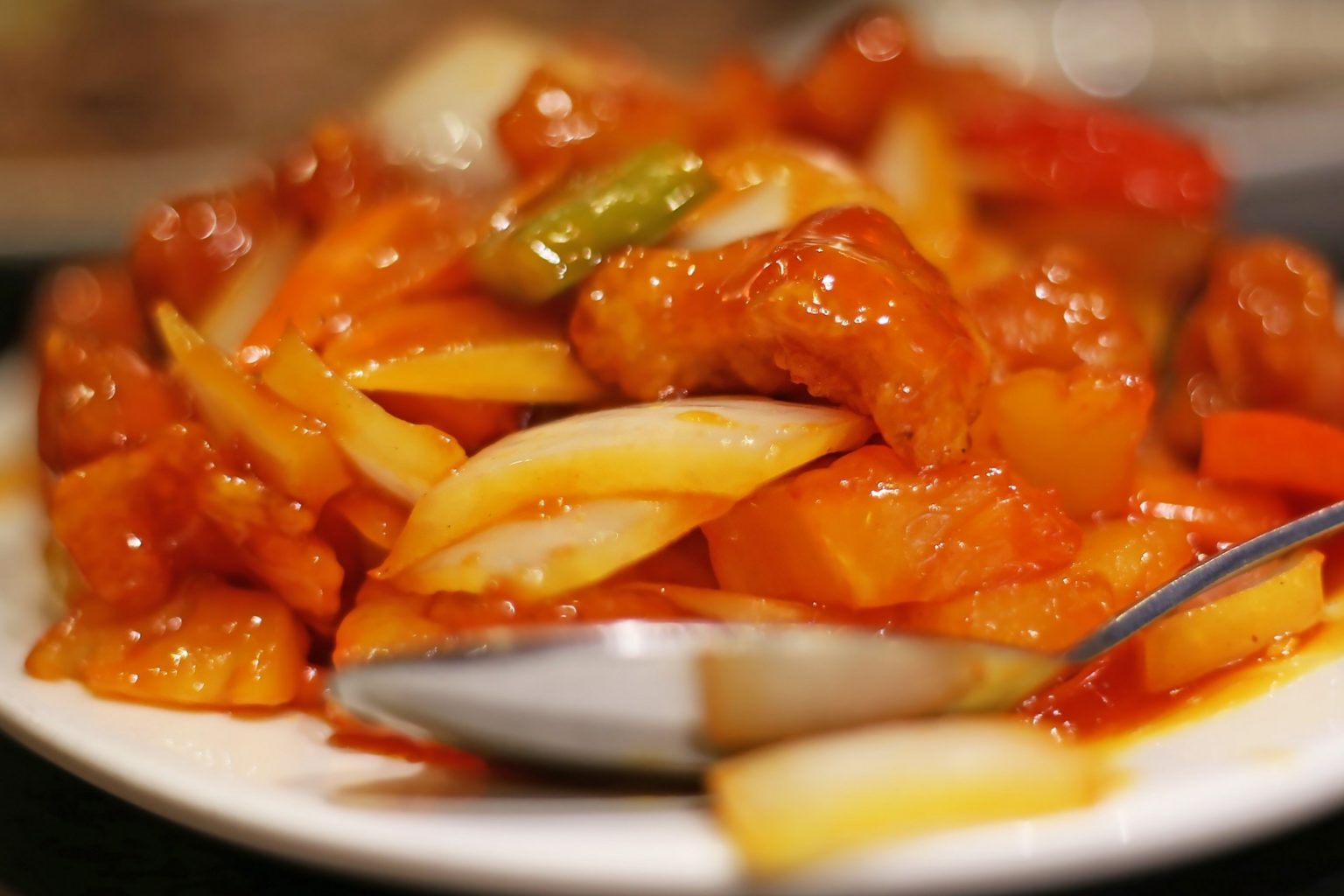 close up of traditional chinese food with duck and sweet sour sauce